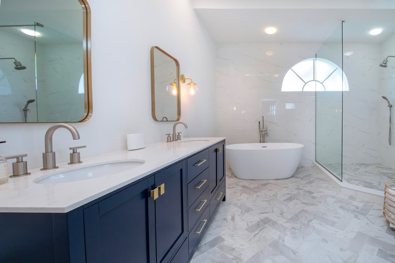 Master bath renovation — navy double vanity & soaking tub