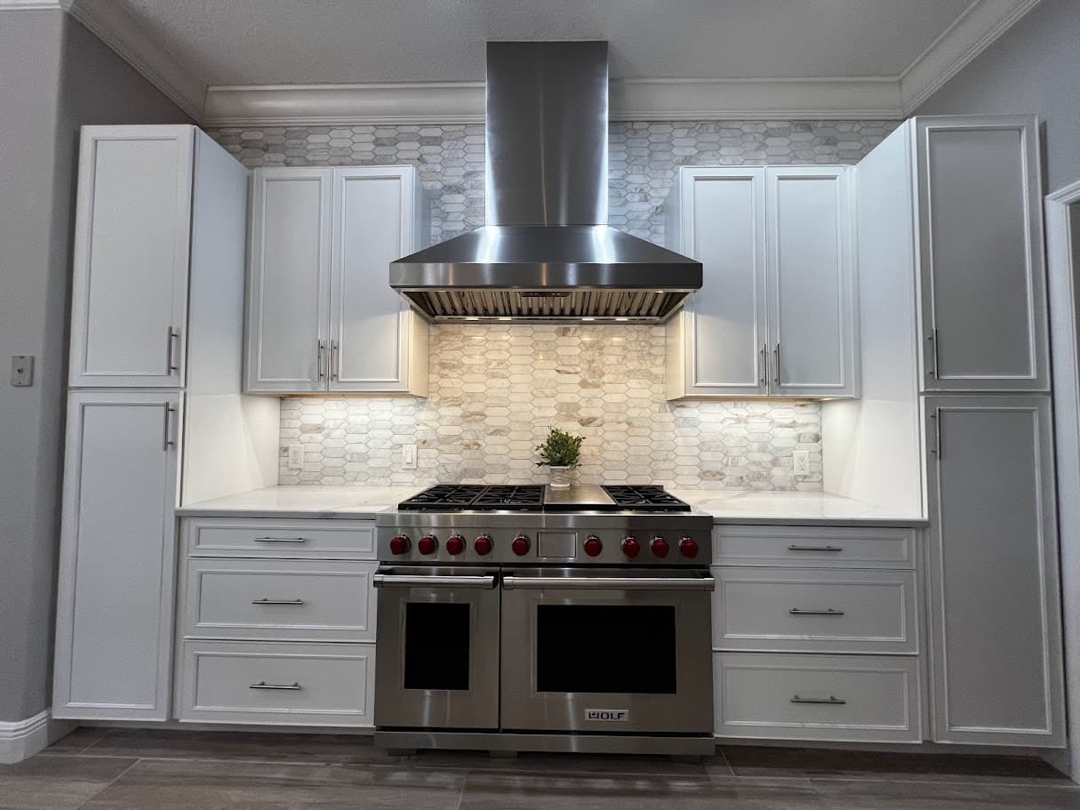 Kitchen detail — Wolf range with hex backsplash
