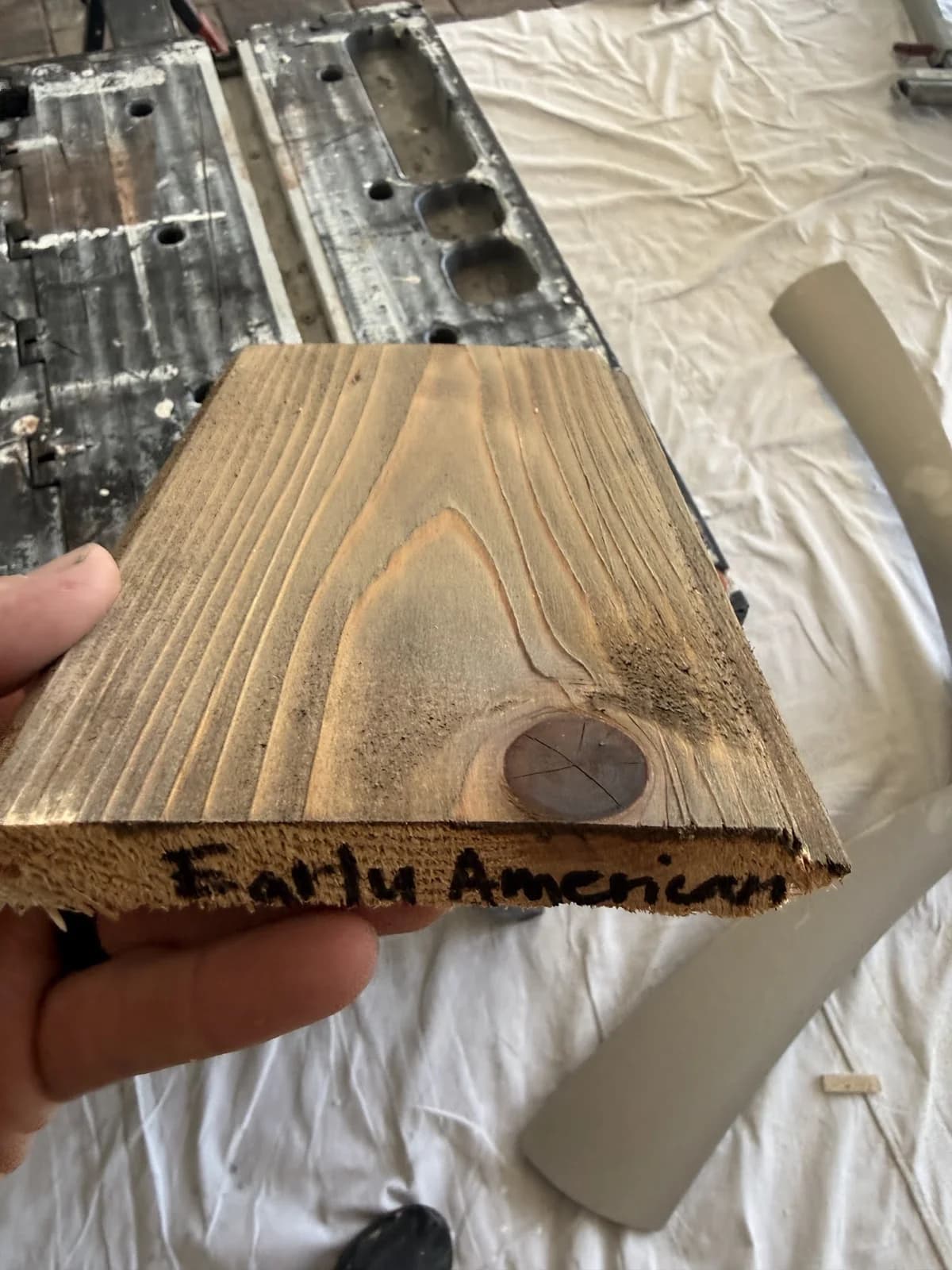 Wood stain sample board with Early American handwritten on its end