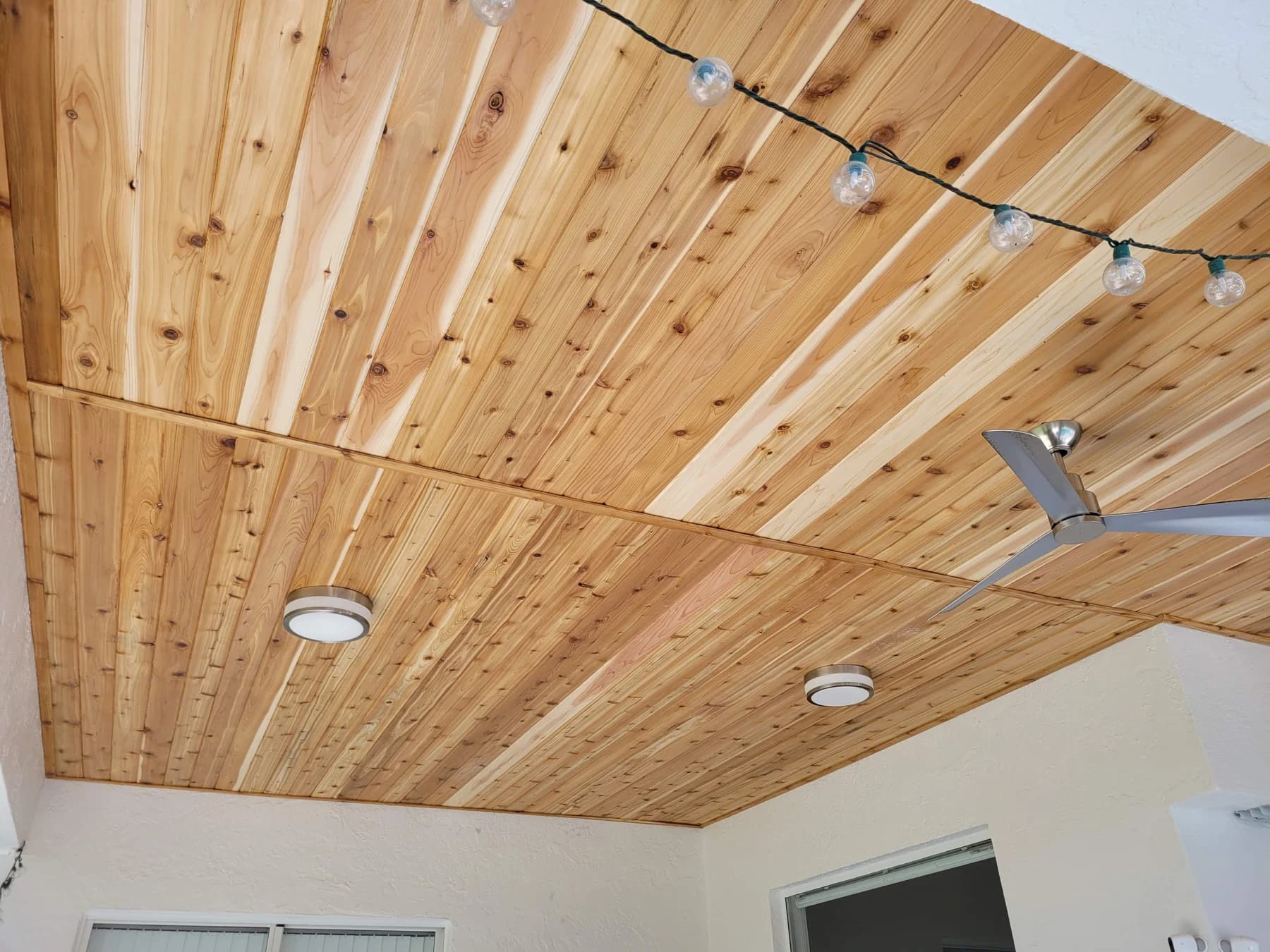 Second view of the screened lanai cedar boards, showing the crosswise joint detail and perimeter